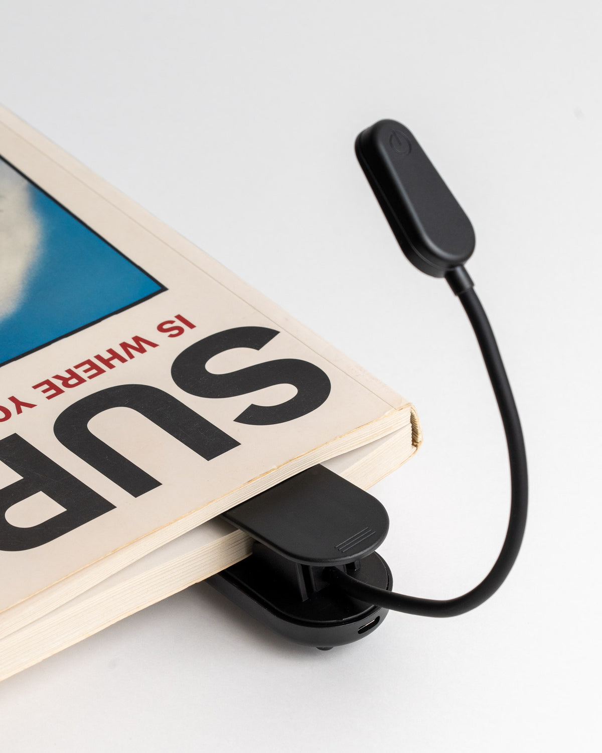 Attaches to books, shelfs and tables