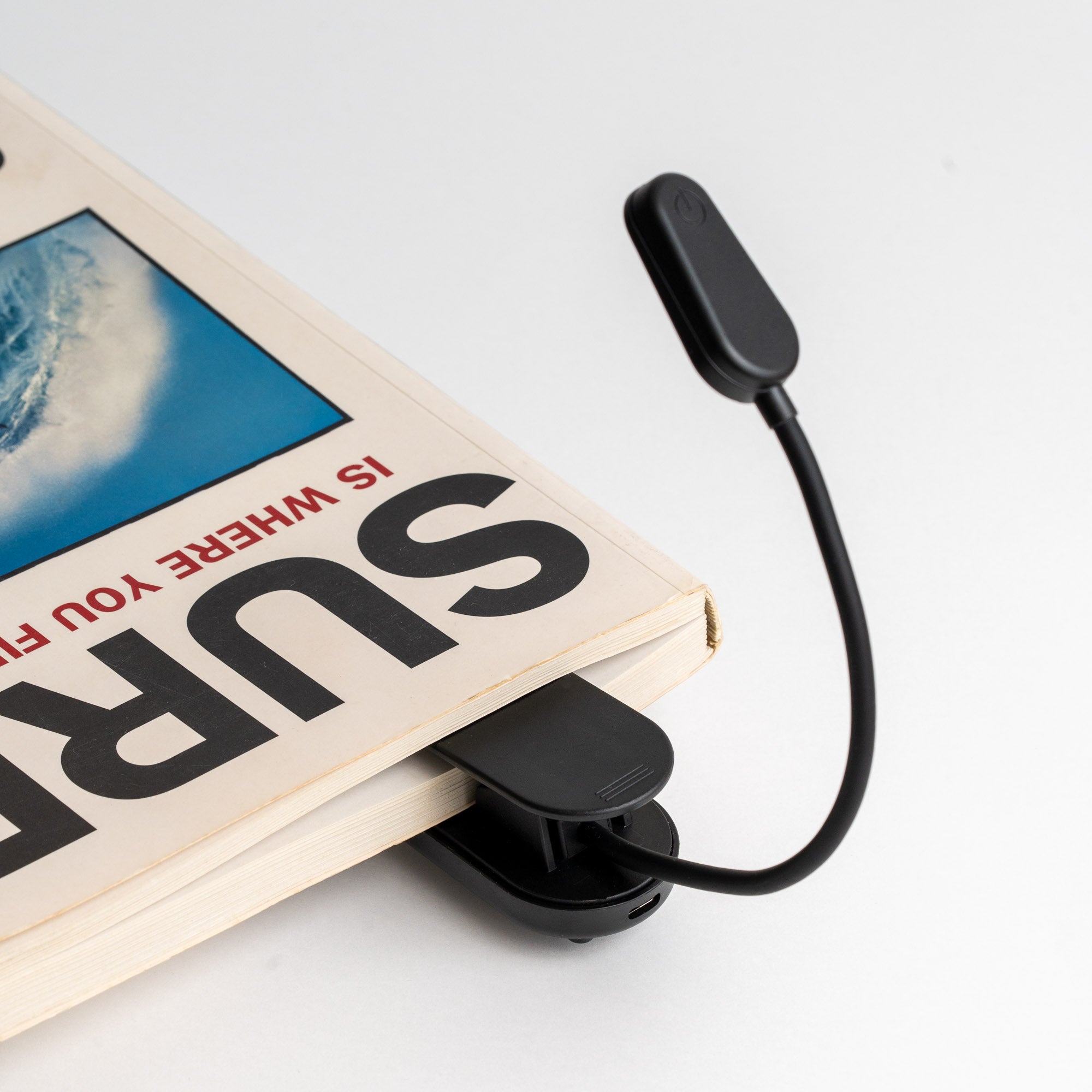Attaches to books, shelfs and tables